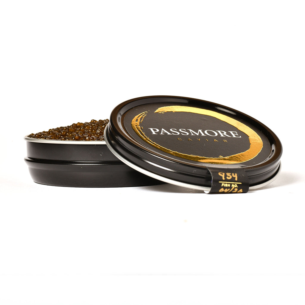 Open tin of Passmore caviar showing glossy black pearls