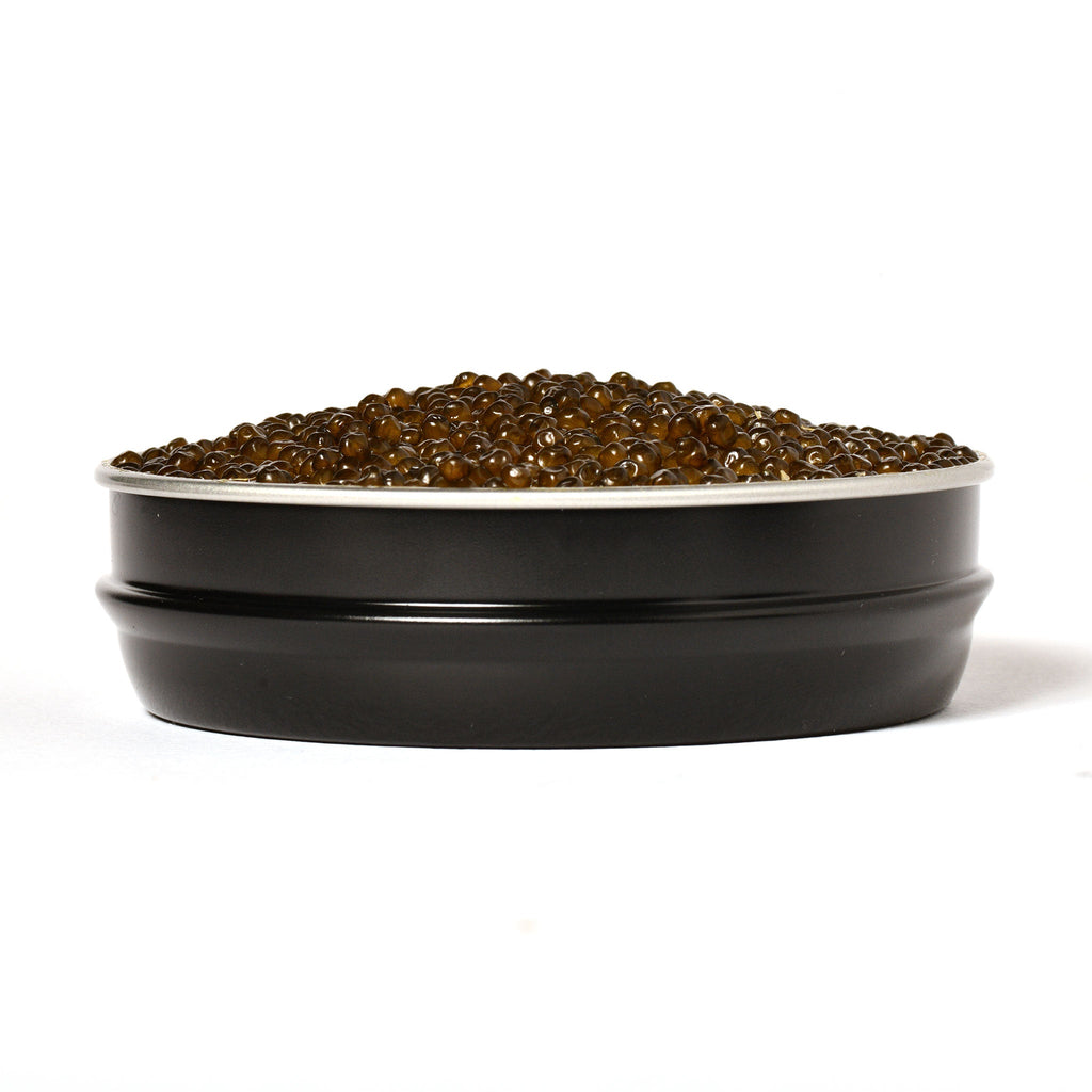 Side view of a filled tin of Passmore Osetra caviar showing glossy golden pearls